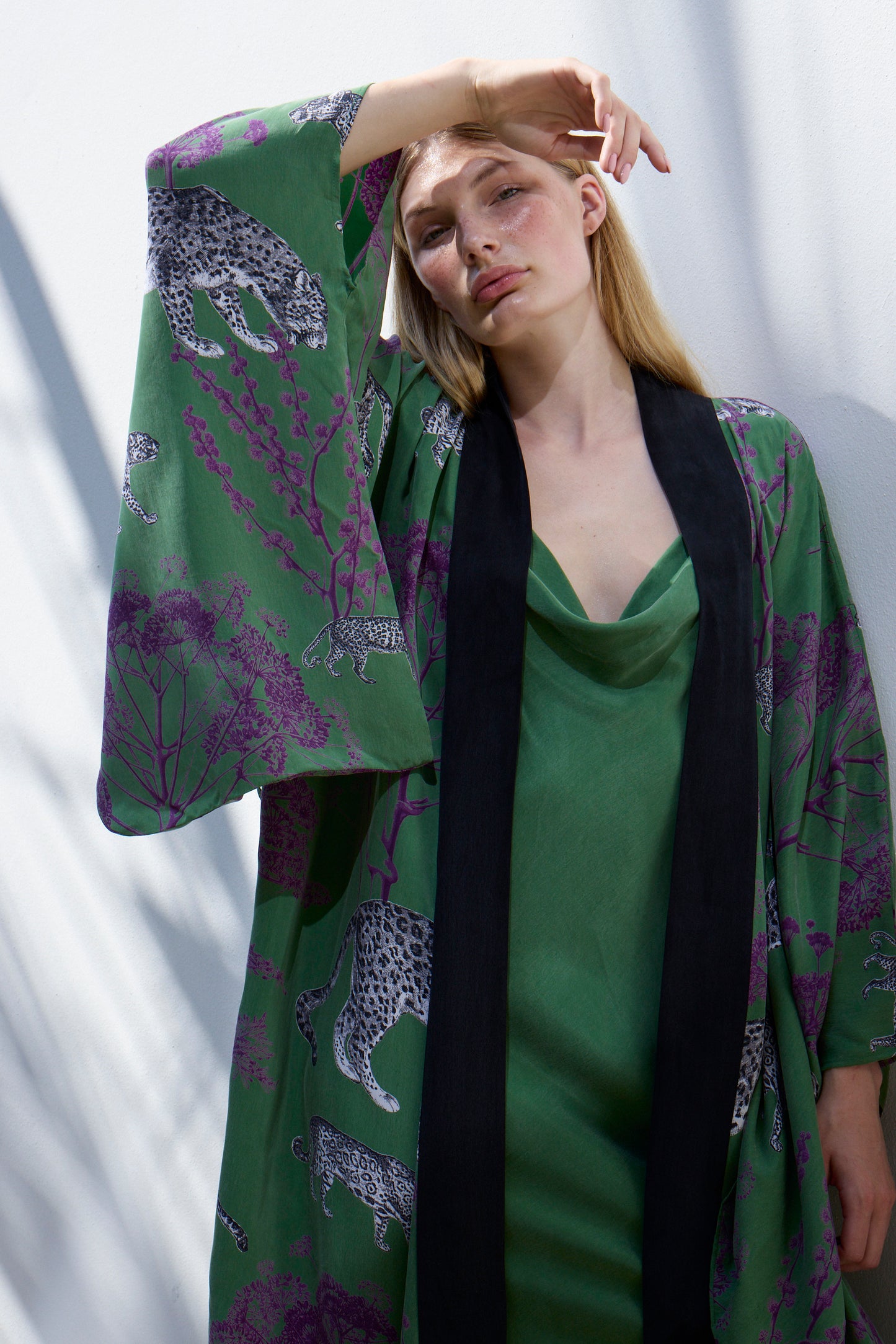 Model wearing Lennon Kimono robe against white wall