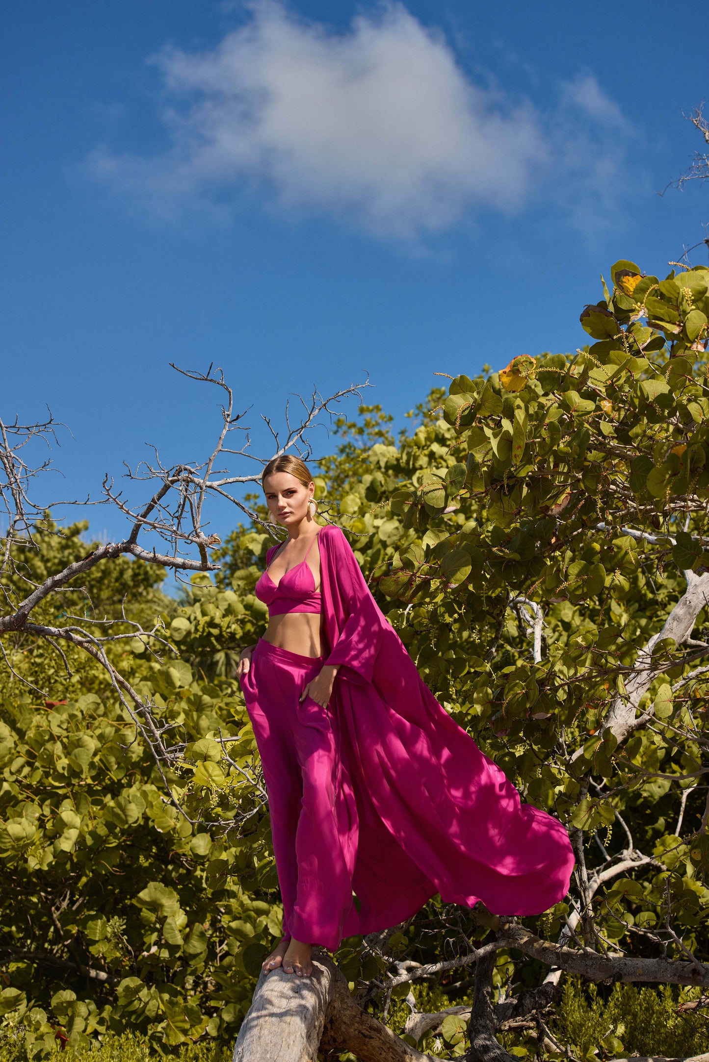 Woman wearing a pink outfit on a white background