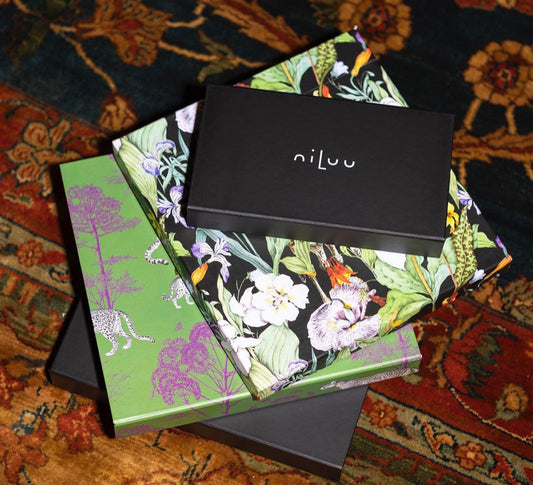 Four gift boxes with vegan silk pieces from niLuu for Valentine’s luxury gifting.