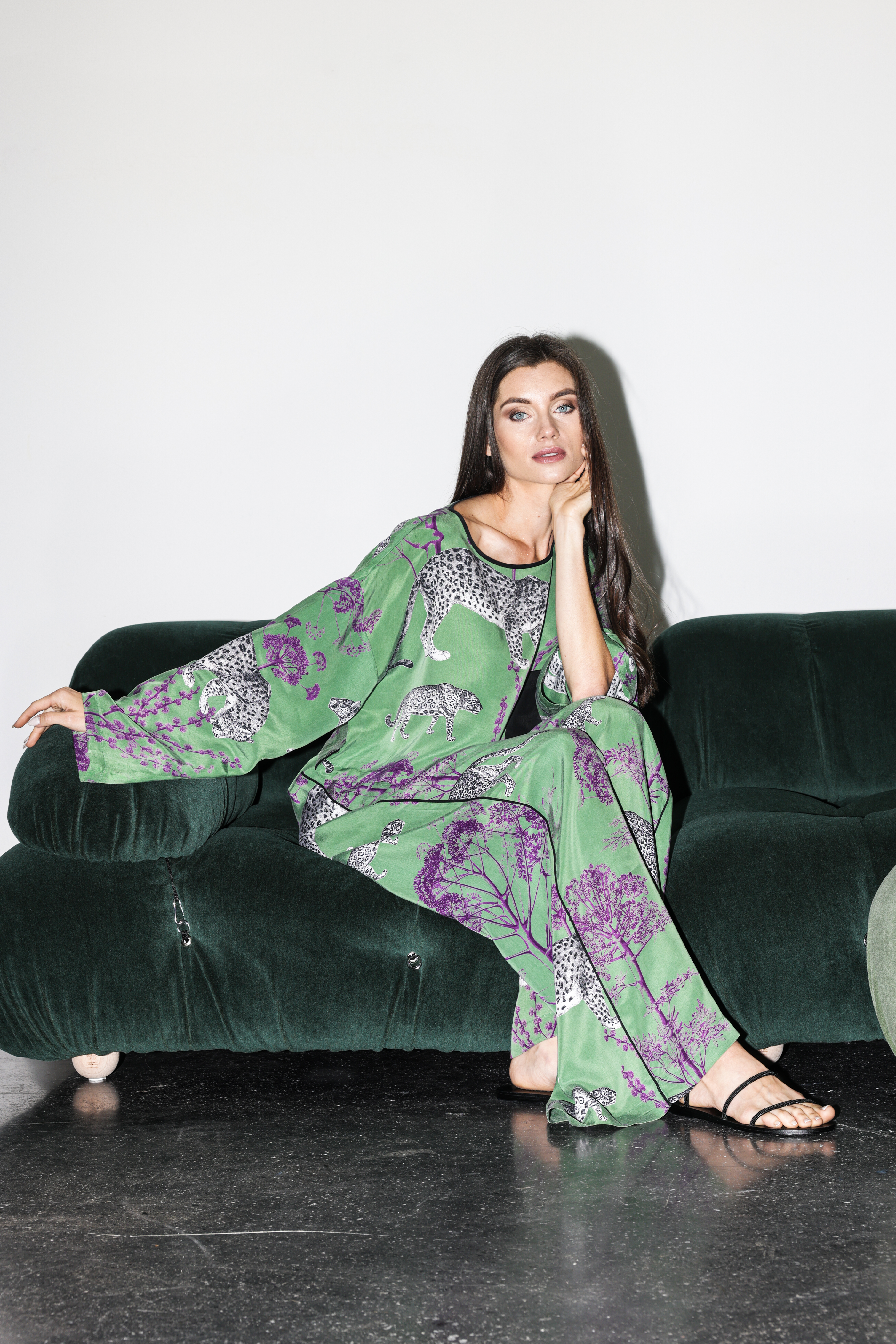 Model wearing Lennon set sitting on couch