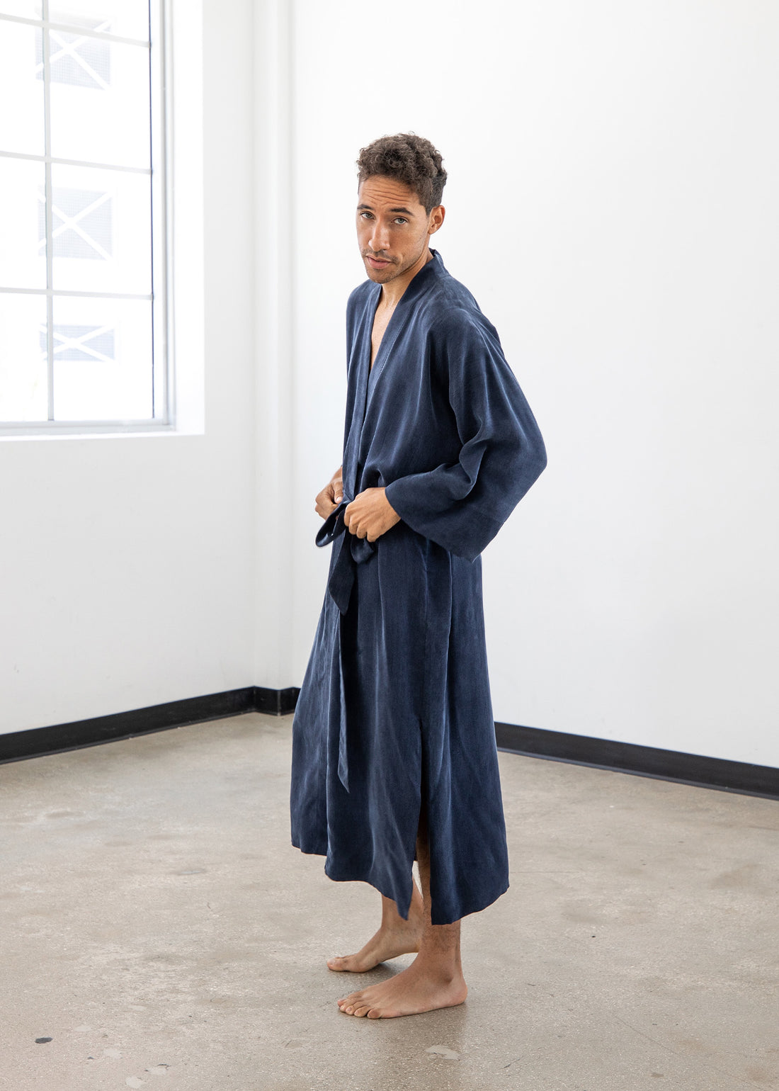 Vegan silk Midnight Blue men’s kimono robe by niLuu — deep navy color with a relaxed fit, wide sleeves, and smooth, graceful drape.