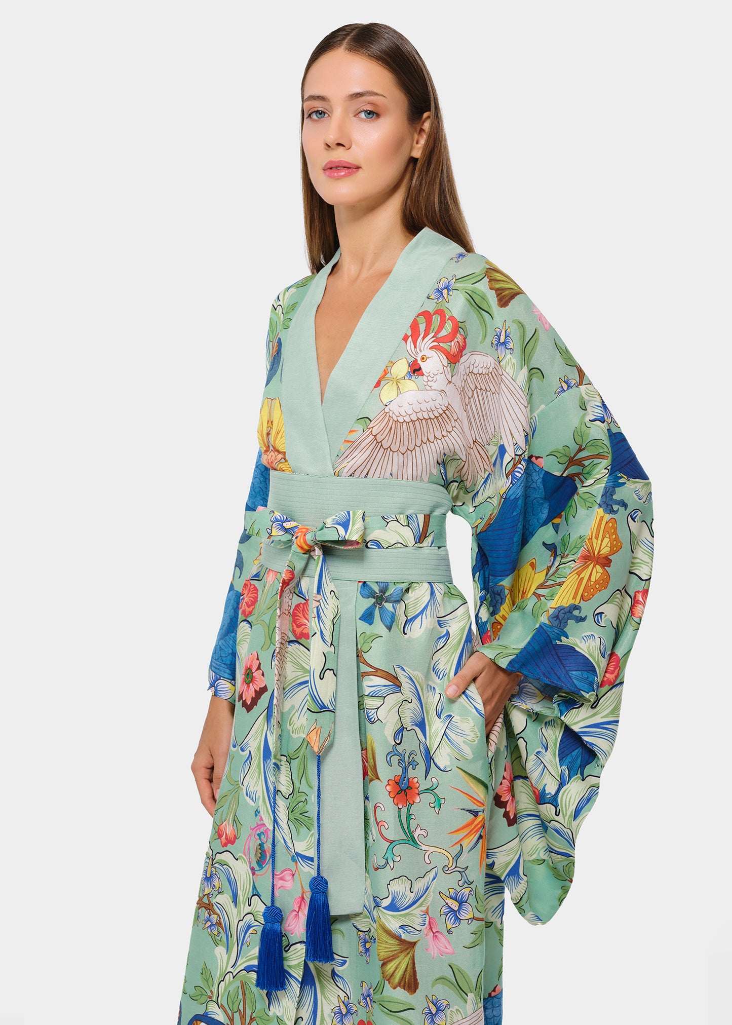 Mint green tropical print kimono robe with wide sleeves and waist tie, shown in side front view.