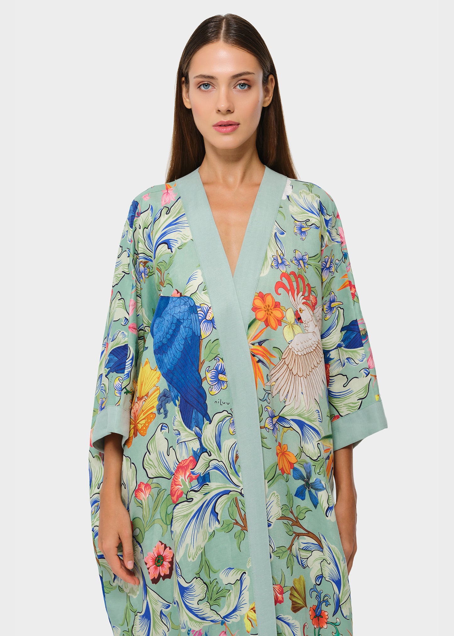 Green floral longline kimono with bird print, front open design and wide sleeves.