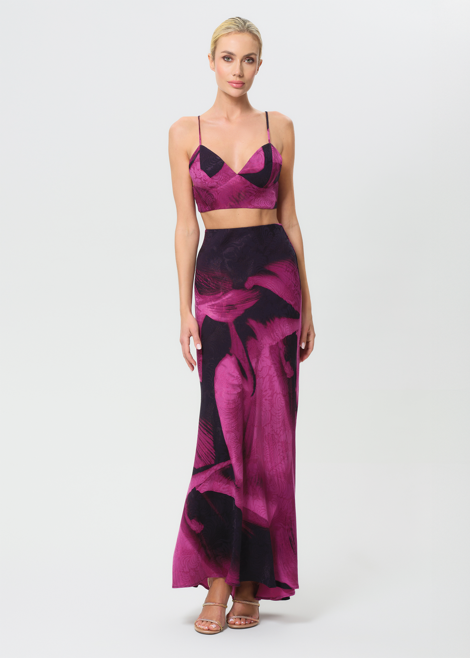 Woman wearing a pink and black skirt on a white background