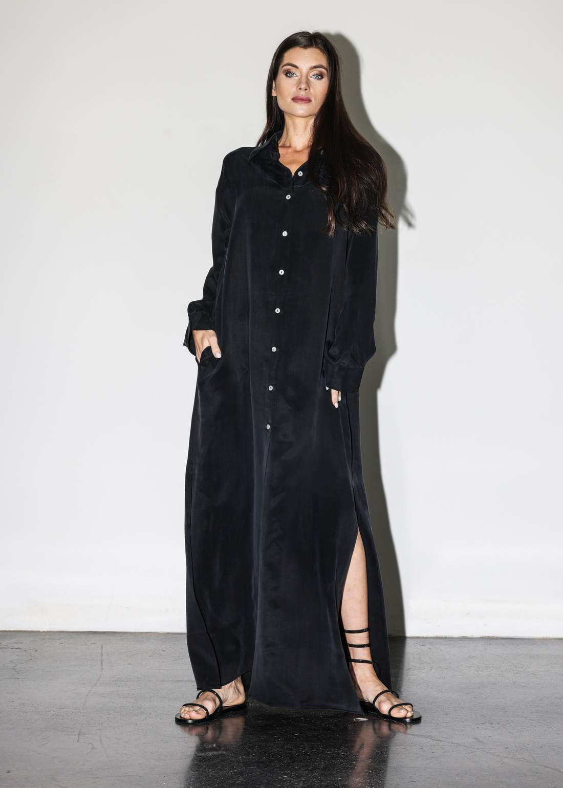 Vegan silk Noir Wildesse Calypso Maxi Dress by niLuu — elegant, floor-length with a soft drape, a rich black hue, and a graceful, flowing silhouette.